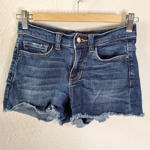 Harper Dark wash distressed cut off jean size 25